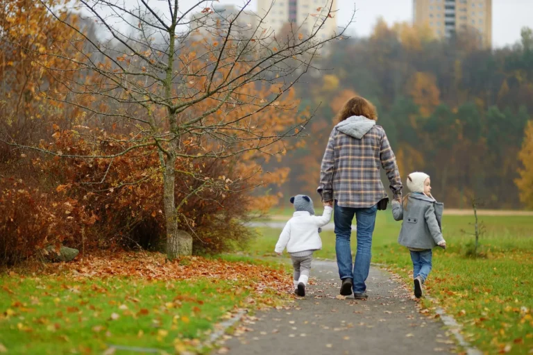 Father walking with his children during the holiday season.